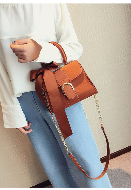 Bow diagonal handbag