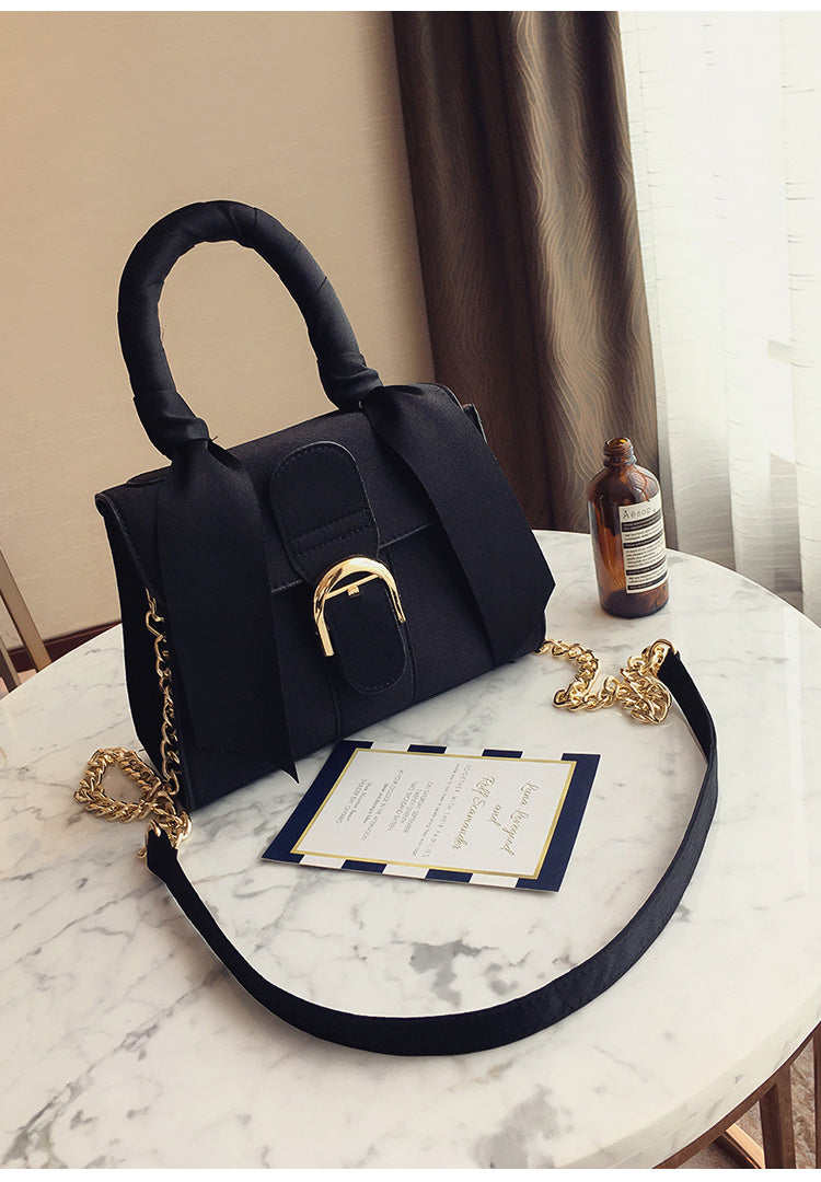 Bow diagonal handbag